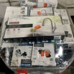 Home Depot pallets with mixed plumbing supplies, faucets, thermostats, pumps, flood lights